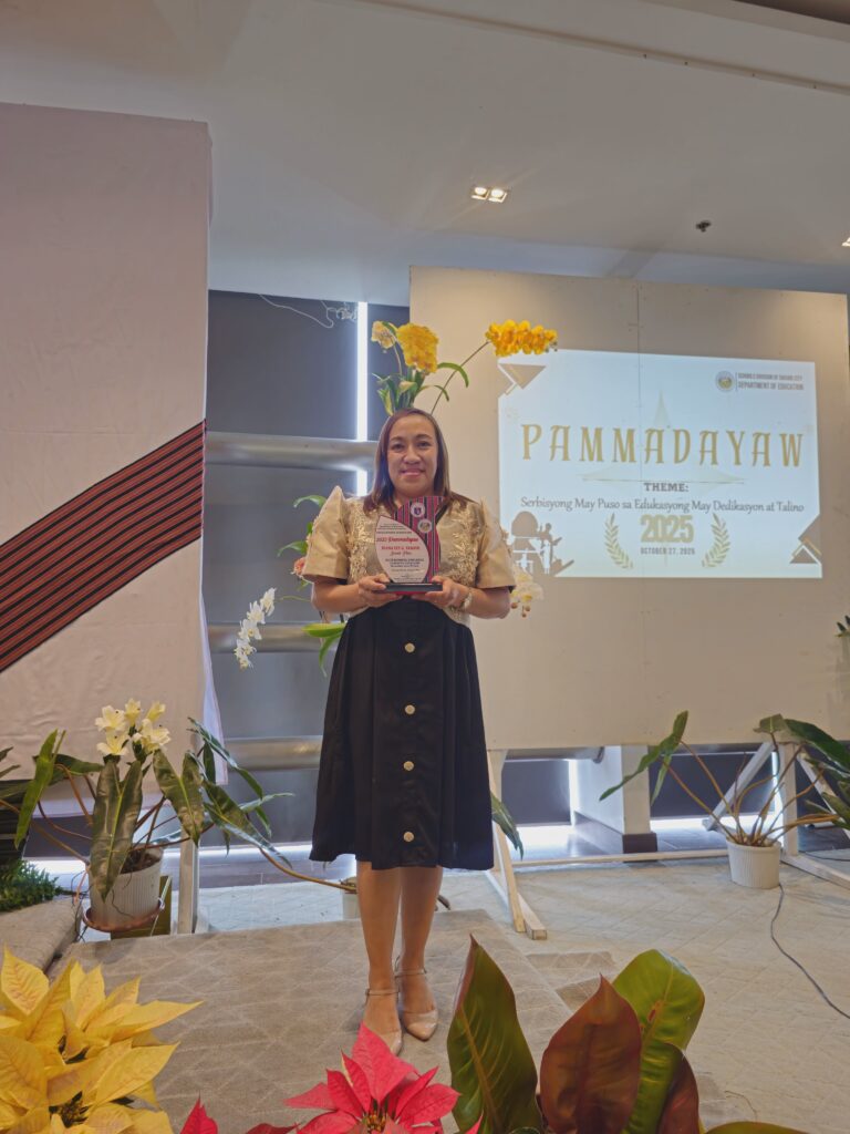 Ms. Diana Lyn G. Tamayo, Assistant Principal of the University of Baguio Laboratory Elementary School (UBLES), reaping her achievement at the 2025 Pammadayaw Awards